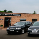 T&A Fyfe Funeral Directors Frontage with Funeral Vehicles parked outside