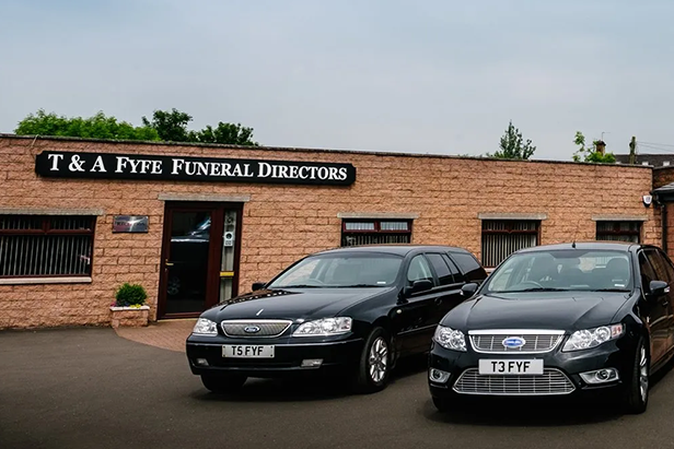 T&A Fyfe Funeral Directors Frontage with Funeral Vehicles parked outside
